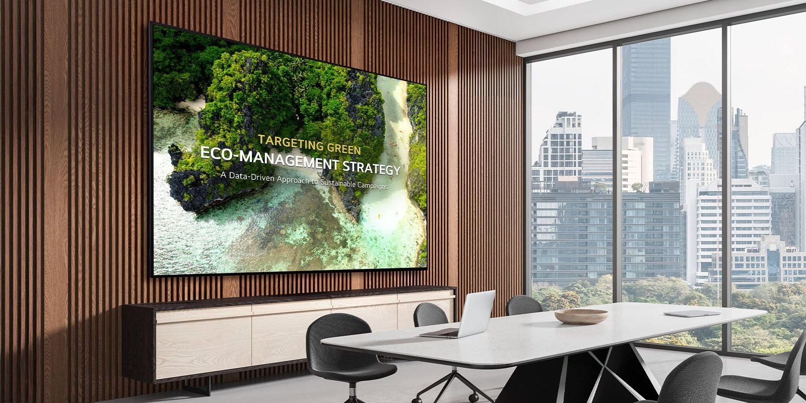 LG 43UL3Q-E 43" UHD Signage 1 A UHD Signage display is mounted on the wall of a meeting room