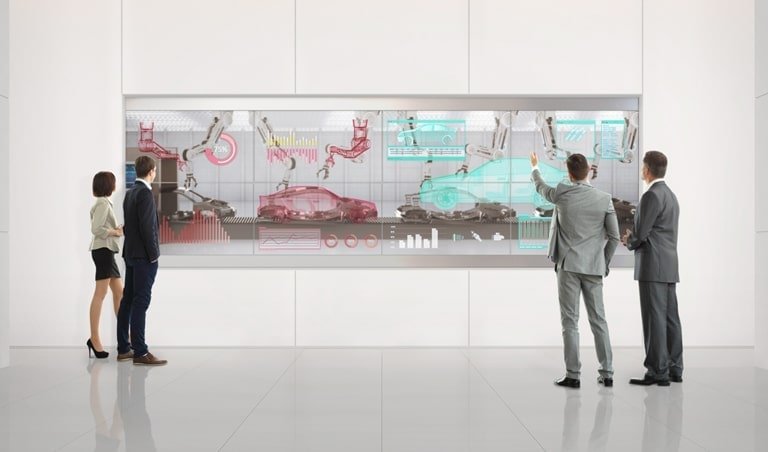 People analyze their work on 55 inch Transparent OLED Signage (SKU: 55EW5G-V) in the lobby. | oled signage